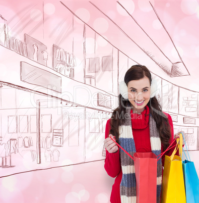 Composite image of brunette in winter clothes holding shopping b