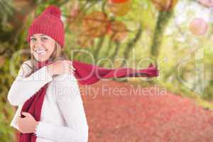 Composite image of happy blonde in winter clothes