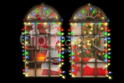 Composite image of santa claus ringing bell