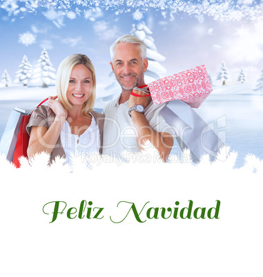 Composite image of happy couple with shopping bags