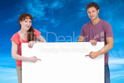 Composite image of couple looking at the camera