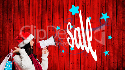 Composite image of woman holding some shopping bags