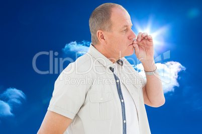 Composite image of older man holding hand to mouth for silence