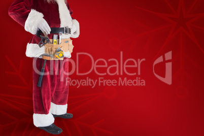 Composite image of father christmas is wearing a tool belt