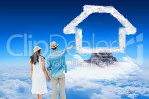 Composite image of happy hipster couple holding hands and lookin