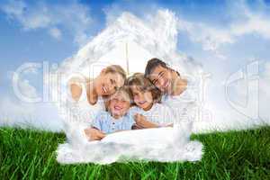 Composite image of happy family reading a book on bed