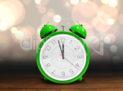 Composite image of alarm clock counting down to twelve