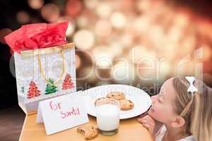 Composite image of milk and cookies left out for santa