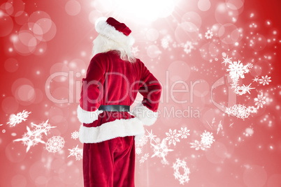 Composite image of santa looks away from the camera
