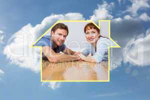 Composite image of couple lying on the floor