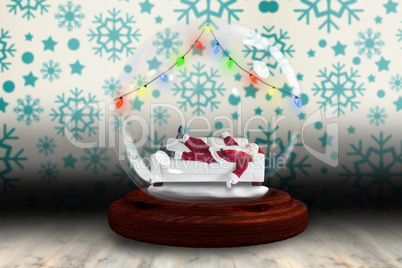 Santa sleeping in snow globe