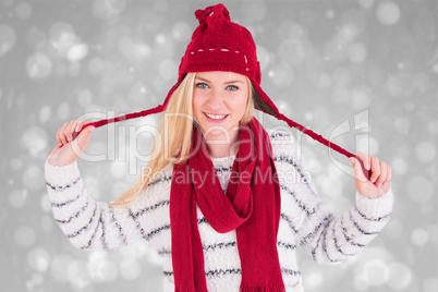 Composite image of festive blonde smiling at camera