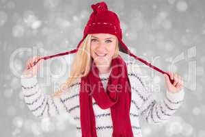 Composite image of festive blonde smiling at camera