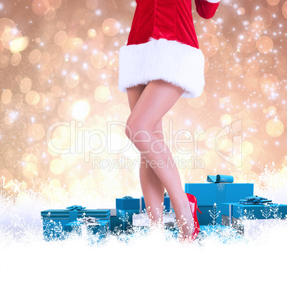 Composite image of lower half of sexy santa girl