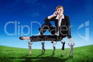 Composite image of business people supporting boss