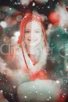 Composite image of festive little girl in hat and scarf