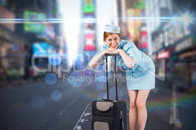 Composite image of pretty air hostess smiling at camera