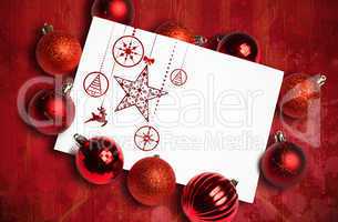 Composite image of hanging red christmas decorations