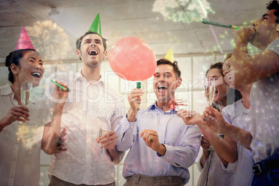 Composite image of casual business team celebrating with champag