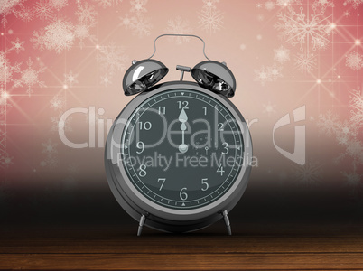 Composite image of alarm clock counting down to twelve