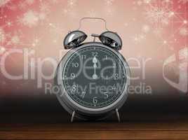 Composite image of alarm clock counting down to twelve