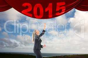 Composite image of businesswoman pulling a chain