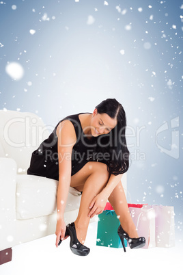 Woman sitting with shopping bags