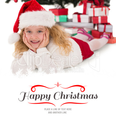 Composite image of festive little girl smiling at camera