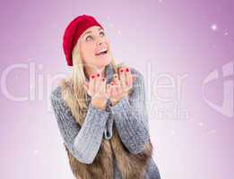 Blonde in winter clothes with hands out