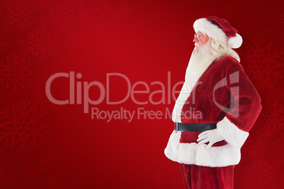 Composite image of santa claus shows his side to camera