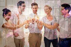 Composite image of casual business team celebrating with champag