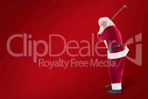 Composite image of santa claus swings his golf club