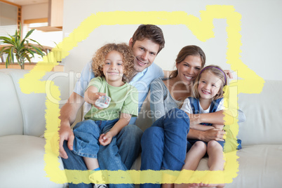 Composite image of smiling family watching tv together