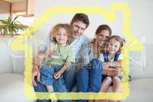 Composite image of smiling family watching tv together