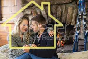 Composite image of romantic couple in front of lit fireplace