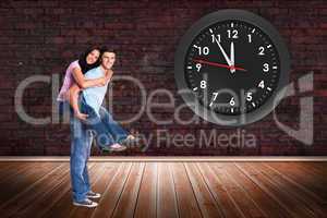 Composite image of young man giving girlfriend a piggyback ride