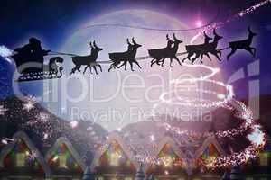 Composite image of silhouette of santa and reindeer