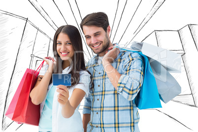 Composite image of couple with shopping bags and credit card