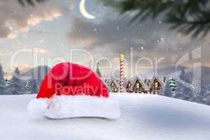 Composite image of santa hat on snow