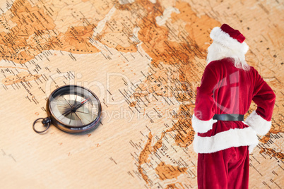 Composite image of santa looks away from the camera