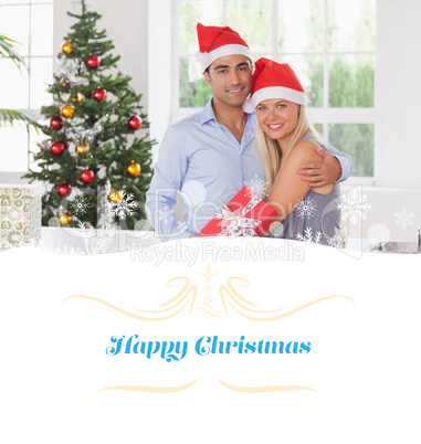 Composite image of happy couple at christmas