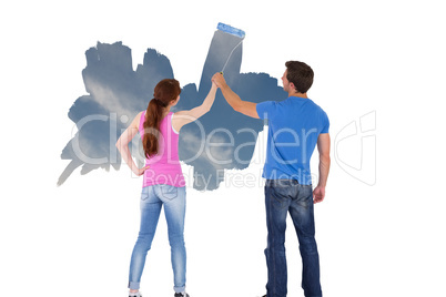 Composite image of couple painting a wall together