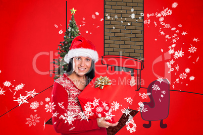 Composite image of young brunette with christmas present