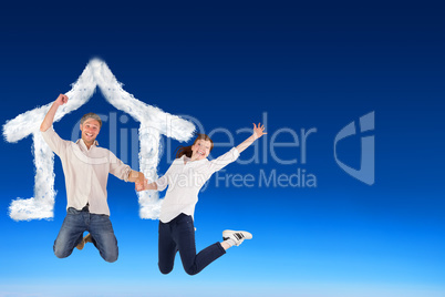 Composite image of couple jumping and holding hands