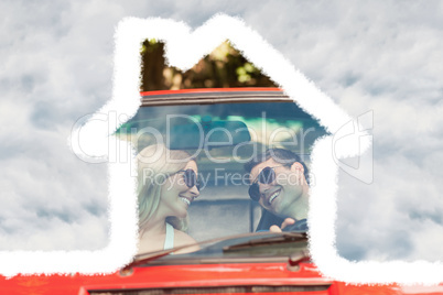 Composite image of loving couple in their red cabriolet having a