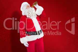 Composite image of father christmas drinking a beer