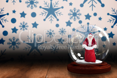 Santa holding open sack snow globe