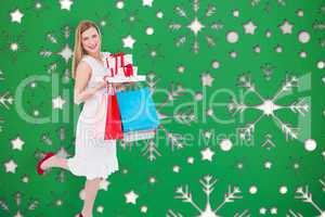 Composite image of pretty blonde with presents