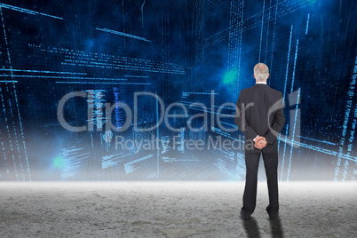 Composite image of rear view of serious businessman posing