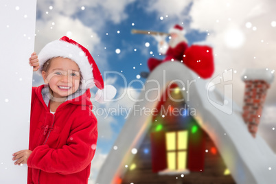 Composite image of festive little girl holding poster